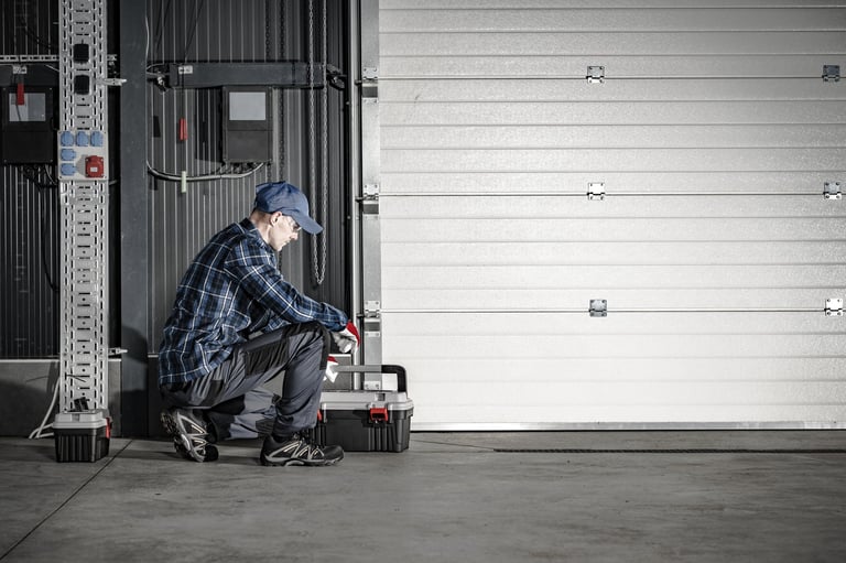 Professional technician servicing garage door