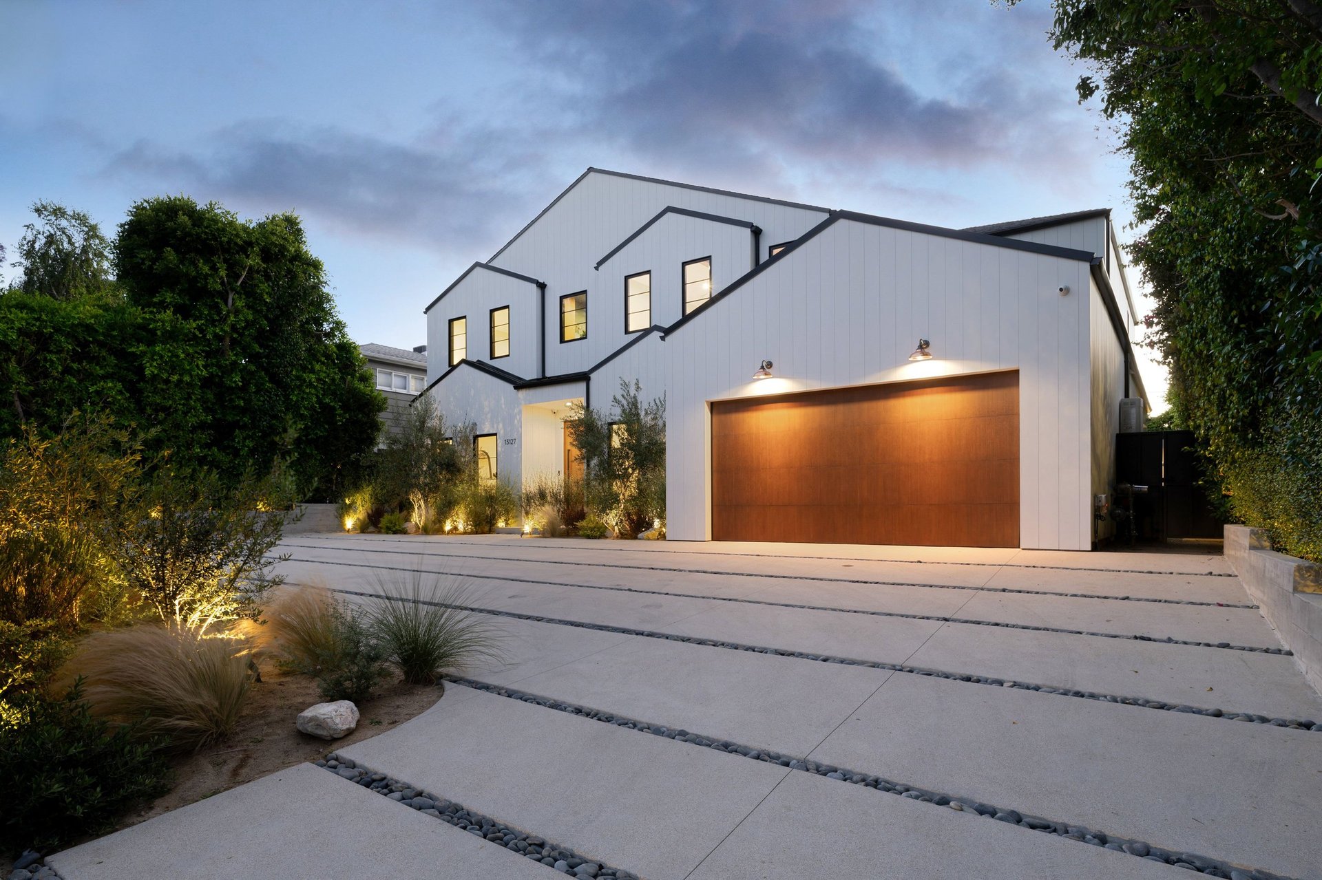 Modern house with wooden garage door installation in Coquitlam BC for residential homes in Tri-Cities Areas
