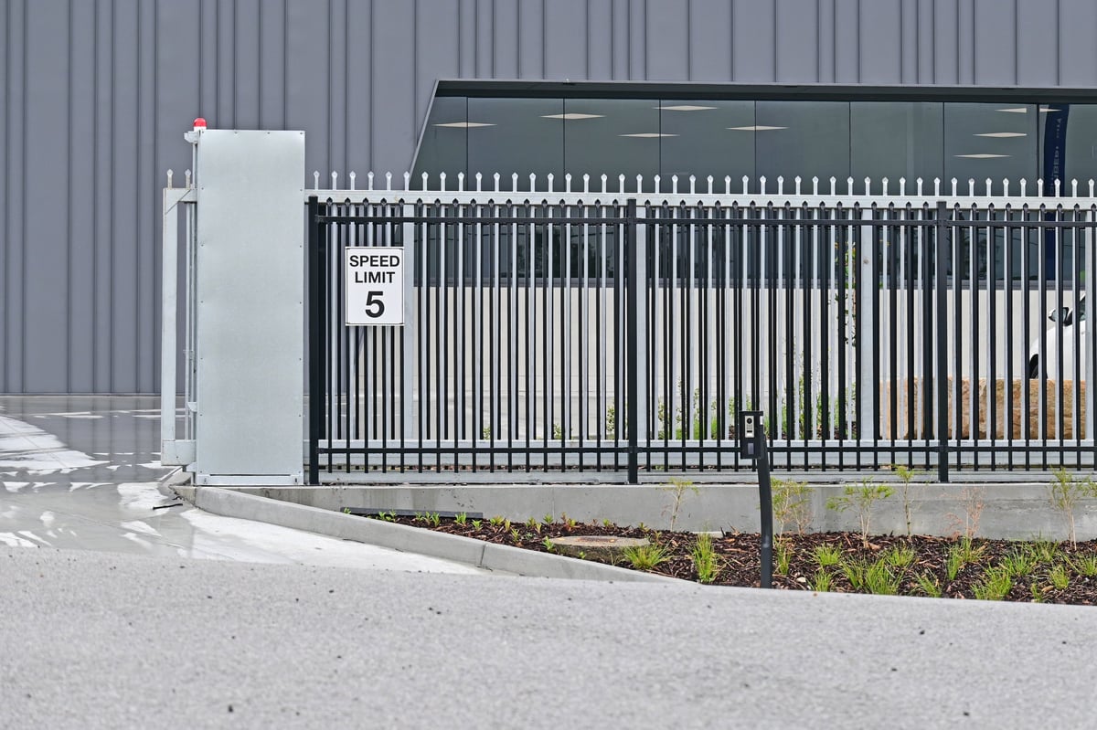 Automatic sliding gate concrete driveway