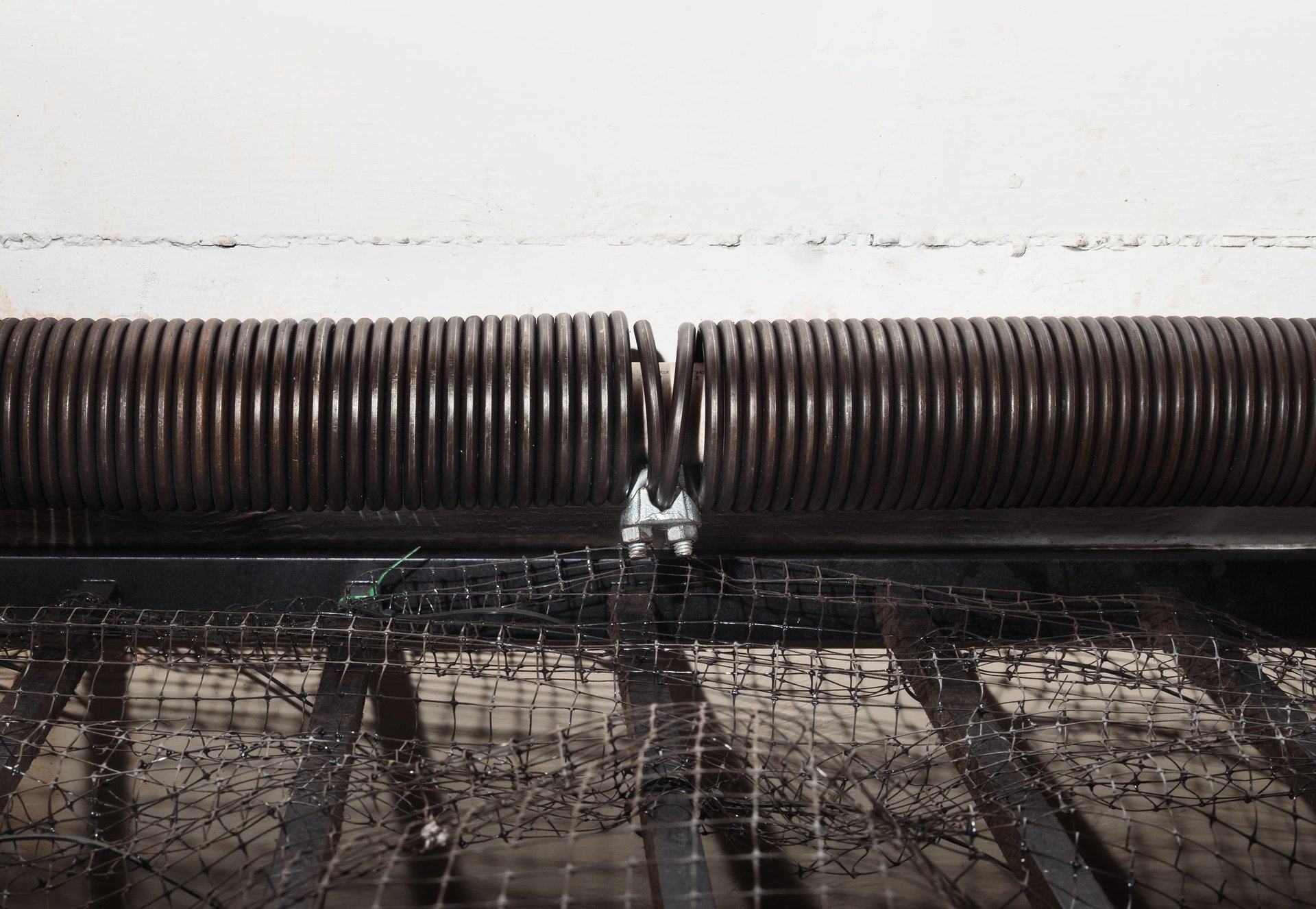 Garage door spring mechanism