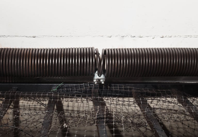 Expert garage door spring repair technician in Coquitlam replacing torsion springs for Fraser Valley homes