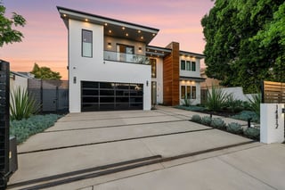 Black garage door luxury home