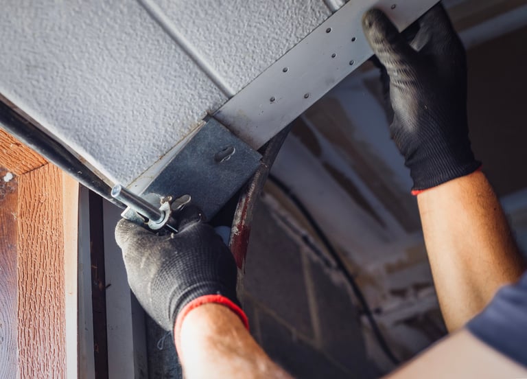 Professional garage door installation technician at work