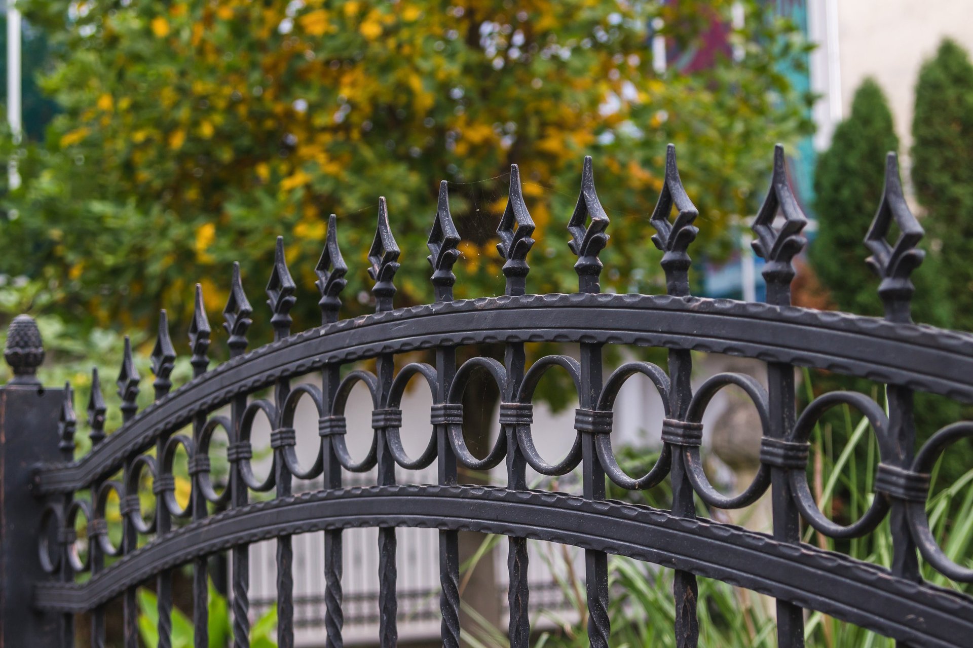 Wrought iron driveway gate at residential property entrance