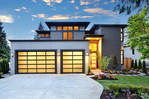 Contemporary home with modern glass garage door in Coquitlam BC for Tri-Cities Areas homeowners