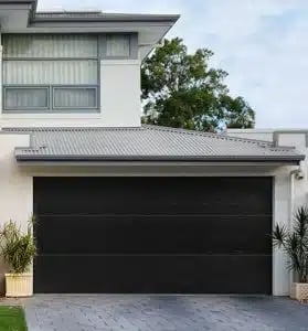 Modern house with black garage door