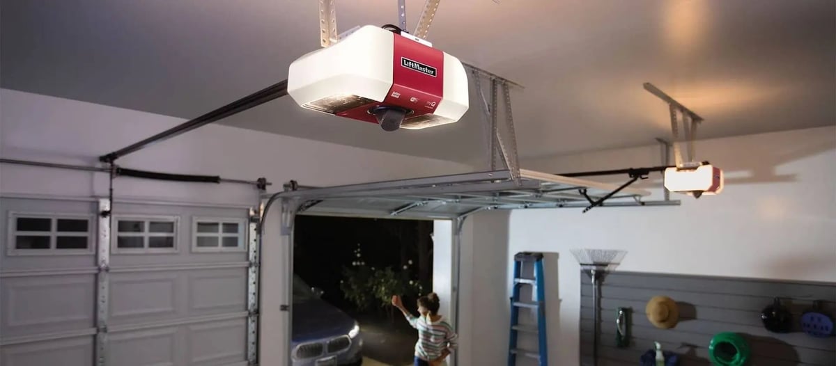 Garage door opener installation Coquitlam — ceiling-mounted opener in residential garage with open door