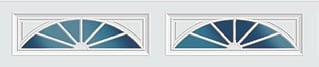 Two decorative transom windows with blue geometric fan panes and white frames