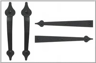 Four black wrought iron decorative hinges and hardware pieces with pointed ends displayed against white background