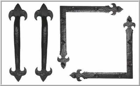 Four ornate black metal decorative handles and corner brackets arranged on white background