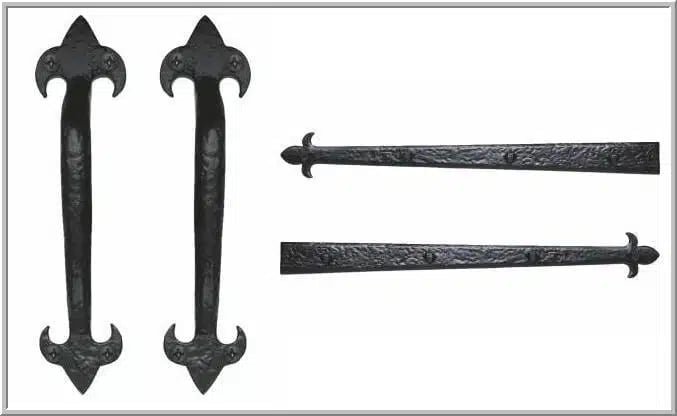 Four ornamental black iron decorative hardware pieces with floral and pointed details