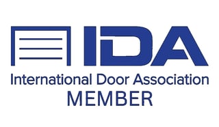 International Door Association member logo featuring door icon with blue text