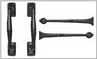 Four antique black metal door handles and hardware pieces displayed against white background
