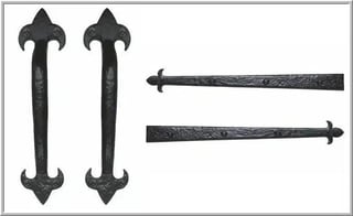 Four black ornamental metal hinges and hardware pieces with decorative floral designs and arrow-shaped ends