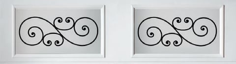 Two white framed ornamental wrought iron scrollwork panels with matching symmetrical black curved designs