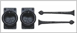 Antique black iron hardware set featuring two ring door knockers and two decorative handle pulls with ornate spade-shaped ends
