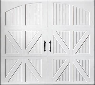 White double garage doors with vertical panels and X-shaped cross braces, featuring two upward-pointing arrows in the center