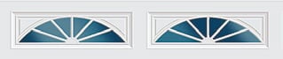 Two blue and white arched transom windows with geometric fan-like pane designs