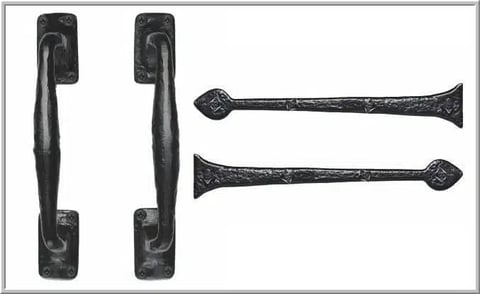 Four black ornamental hardware pieces: two decorative door handles with curved grips and two tapered pulls with diamond-shaped ends