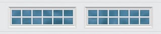 Two white garage doors with blue panel windows arranged in a grid pattern